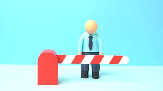 An office worker is sad because the road is blocked by a barrier. Mass layoffs, travel restrictions and limits caused by corporate policy and NDA agreements.