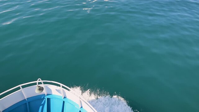 Ship bow sailing on tranquil turquoise sea water