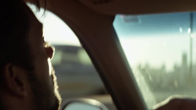 Man driving a car on a sunny day in Los Angeles, California