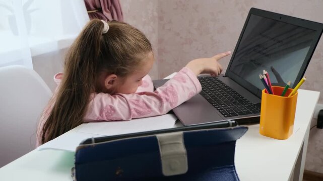 Hybrid learning child doing homework at home education concept