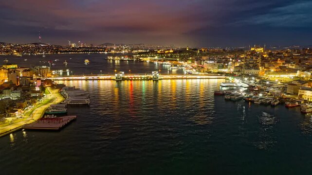 Night time-lapse of the Galata Bridge and boats