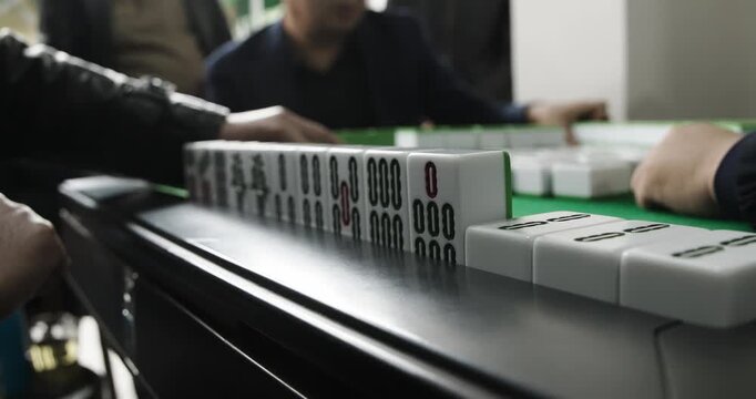 Chengdu, Sichuan, China. Men Playing Mahjong At Automatic Mahjong Table. Friendly