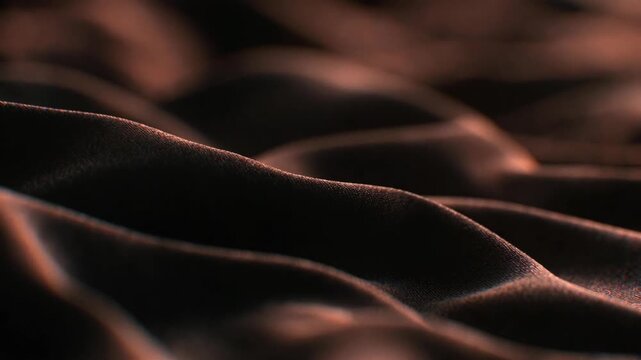 Soft dark fabric folds in macro style on a shadowed background, conveying elegance and texture for abstract design
