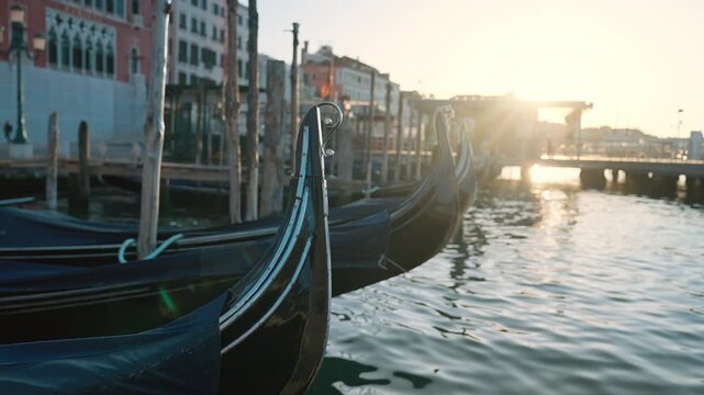 Traditional Gondolas Near Venetian Waterfront, Historic Italy Transport. Italian culture, architecture, tourism and authentic European city content.