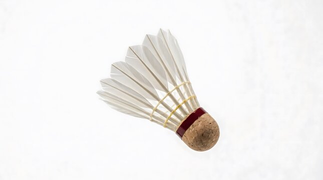A single badminton shuttlecock isolated on a clean white background