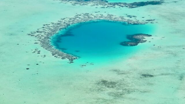 Top view of atoll with a coral reef and clear turquoise water. Borneo, Malaysia.