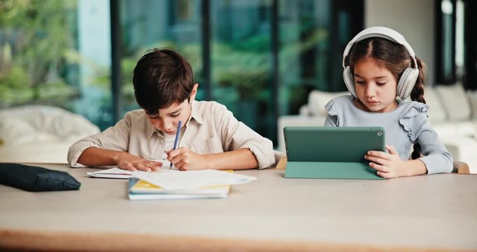 Homework, siblings and kids on tablet in home for online learning, education and lesson. Family, happy and boy with girl with tech, headphones and book for assignment, study and child development