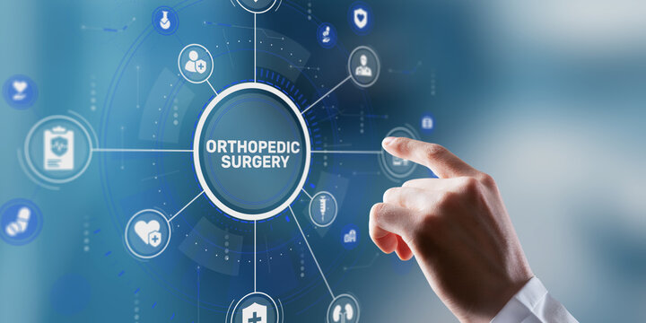 A doctor's hand in a medical coat presses the ORTHOPEDIC SURGERY button on a digital interface