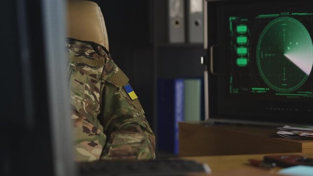 Ukrainian army officer monitoring radar air threats in military command hub