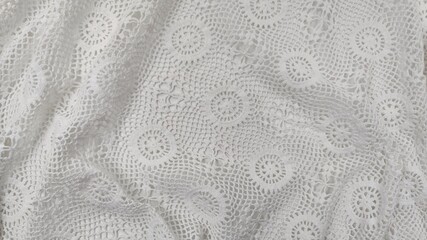 Background view of an elegant white vintage crochet lace textile with intricate handmade needlework, a full frame background texture. © Antonios