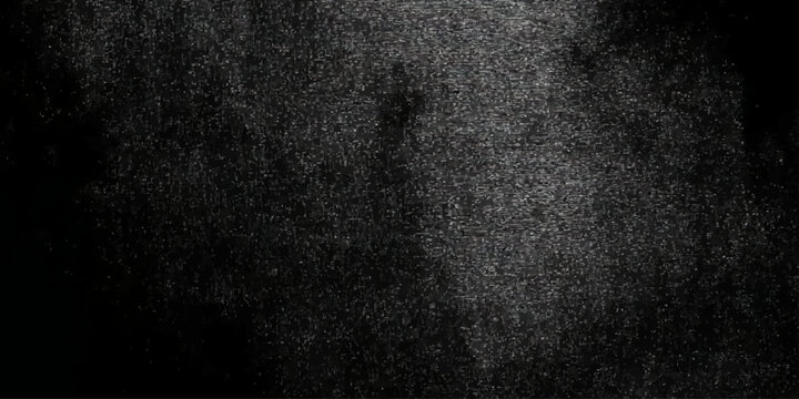 Grainy noise texture with white speckles on dark background for overlay and design