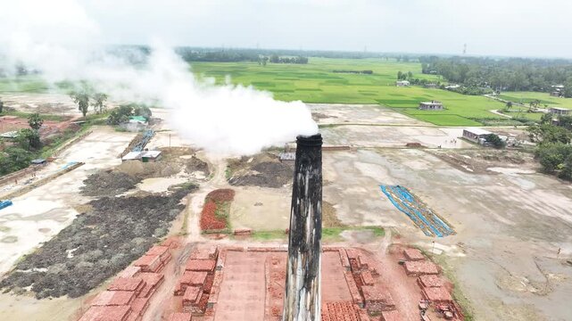 Aerial view of a brick kiln releasing smoke and polluting the environment