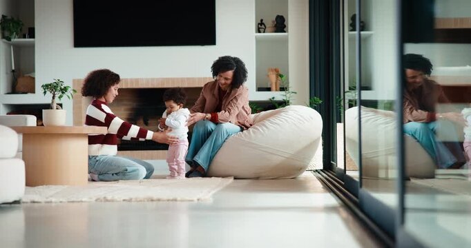 Family, baby and learning to walk at house for first steps, balance support and emotional moment. Applause, mother and daughter with toddler, teaching coordination or milestone encouragement