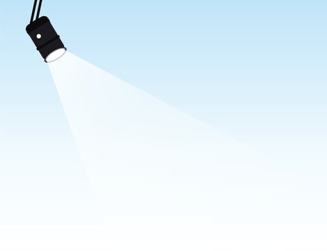 Black flashlight shining bright white light on blue background