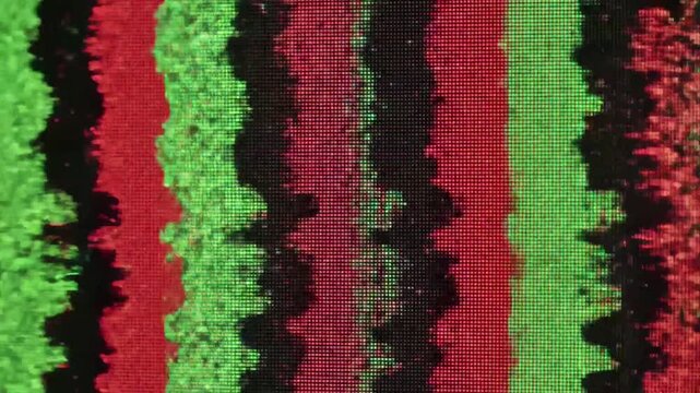 A green and red noise glitch effect on a screen abstract rewind pattern on black screen background, static noise overlay, retro tv display, signal distortion