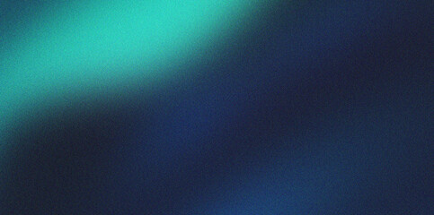 Obraz premium Cyan light leak on grainy dark blue background providing vintage film aesthetic for creative overlays stylish glowing highlight with subtle noise and textured appearance.