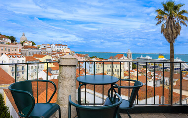 Fototapeta premium High angle view from Santa Luzia Viewpoint overlooking the historical Alfama district and a cruise ship on the Tagus River in Lisbon Portugal Europe