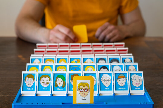 Ede, The Netherlands, 22.05.2026, Classic Guess Who? Board Game Vintage Edition Gameplay, Popular Family Tabletop Game with Cartoon Character Cards