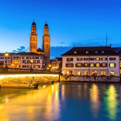 Obraz premium Nighttime cityscape with illuminated buildings river.