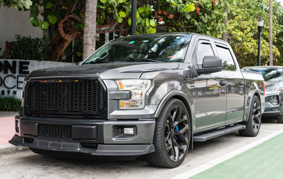 Miami, Florida, USA - December 19, 2025: Ford F150 2017 pickup truck car. Luxury pickup truck car Ford F150. Car Ford F150 parked outdoor. Black car, front view