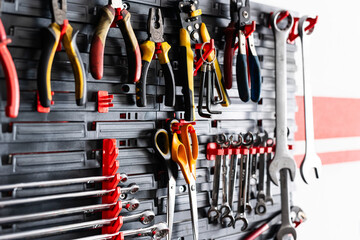 Garage Wall-Mounted Tool Organizer And Auto Mechanic Instruments At The Workplace