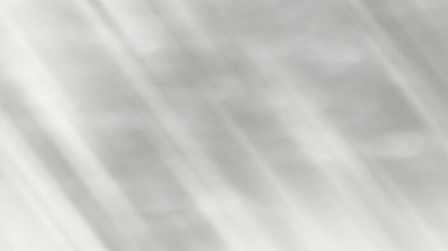 Abstract grey diagonal light streaks soft shadows blurry surface hazy neutral background suitable for modern design projects and artistic backgrounds.