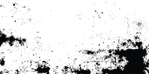 Obraz premium Grunge texture background with black and white abstract splatters and smudges for creative design projects