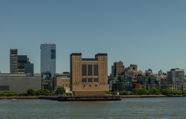 Obraz premium Scenic Westbeth Power House building vista on a sunny summer day viewed from a boat, Manhattan, New York City