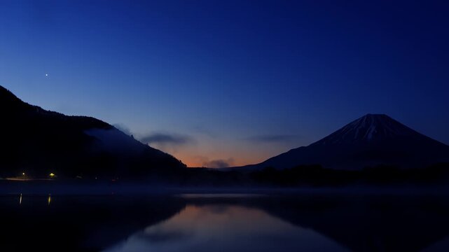 (HDR PQ 2100 10bit 4:2:2) - 4K Timelapse Dawn Mist over Lake Shoji with Mount Fuji Silhouette and Brightening Morning Sky.
