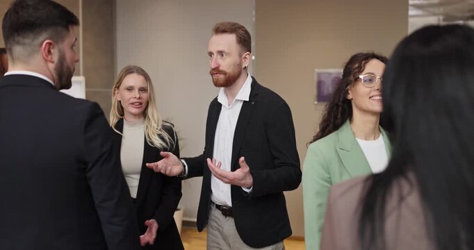 Business professionals networking discussion meeting conversation communication. Colleagues and team talk at a corporate office event. Concept highlights corporate networking and teamwork.