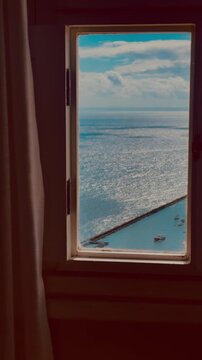 Vista para o mar pela janela em Salvador, Bahia, com a Ba&iacute;a de Todos-os-Santos | Sea view through a window in Salvador, Bahia, overlooking All Saints Bay