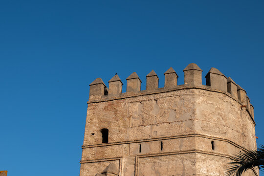 Ancient Moorish defensive wall of Macarena under clear blue sky in Seville Spain