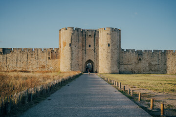 Obraz premium Medieval fortress walls of Aigues-Mortes in southern France at sunset