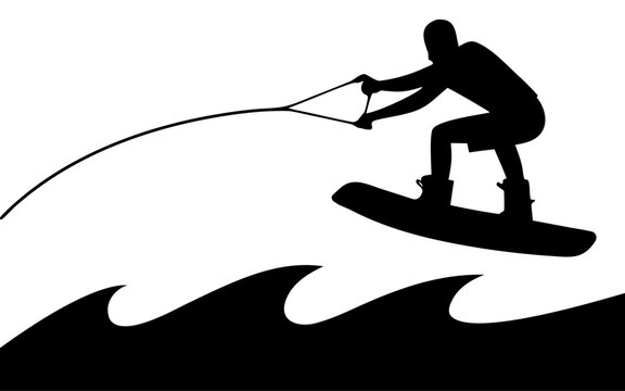 Silhouette of a wakeboarder jumping over waves holding a tow rope