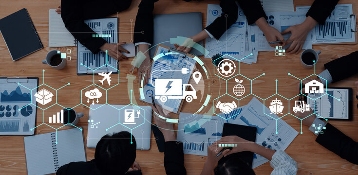Collaborative Business Meeting with Data Analysis and Logistics Planning Overlaid with Digital Icons and Graphics Haptic.
