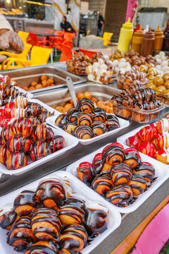 Cairo, Egypt - 26 Jan, 2026: Sweet fried pastries on sale on steet food stand in Cairo, Egypt