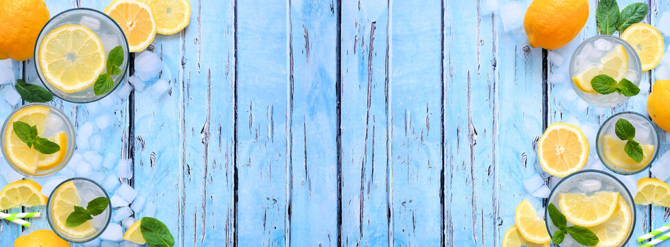 Sweet summer lemonade double border. Above on a rustic blue wood banner background with copy space.