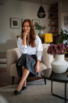 Portrait of a stylish woman in a sophisticated modern living room