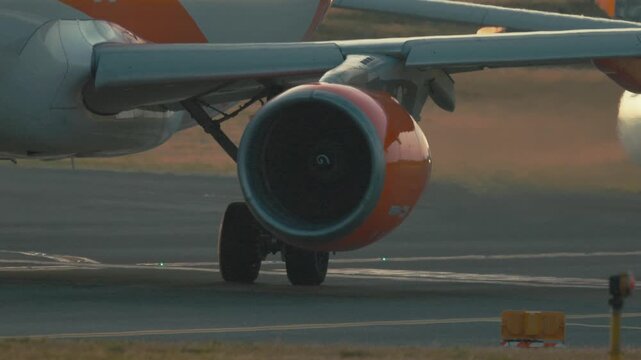 Jet engines prepare for takeoff at the airport as planes taxi and get ready for departure