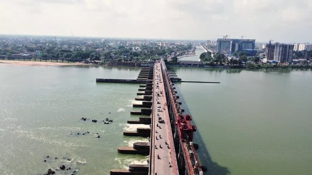 Aerial View of Mahanadi Barrage and Bridge with Indian City Traffic in Cuttack. Long River Barrage and Water Gates in Odisha India. Massive Water Regulation Barrage Infrastructure.