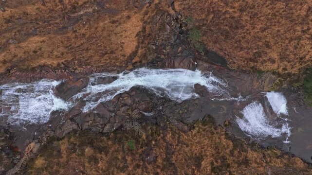 Aerial top down view of eas a' bhradain waterfall in scotland
