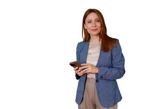 Professional businesswoman holding smartphone, smiling and sending message, standing in blue blazer on transparent background