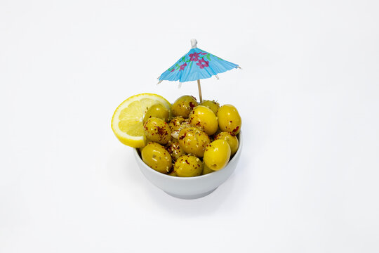 Breakfast olive varieties photographed on a white background.