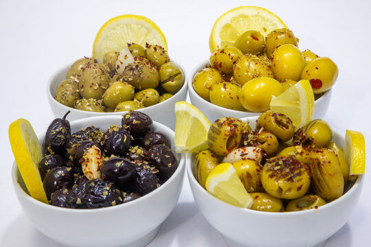 Breakfast olive varieties photographed on a white background.