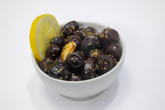 Breakfast olive varieties photographed on a white background.