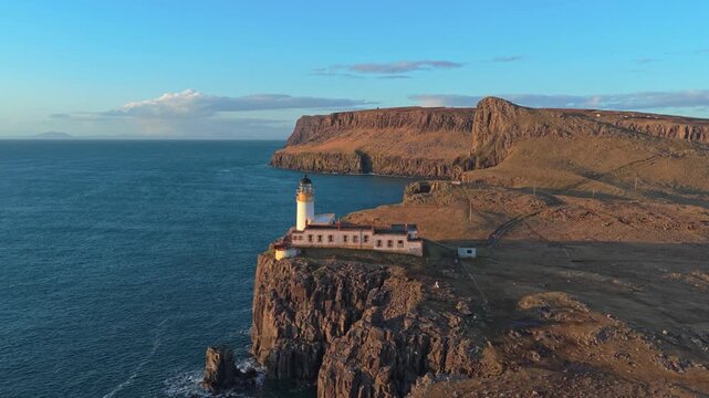 Scenic neist point lighthouse on the isle of skye in scotland at sunset