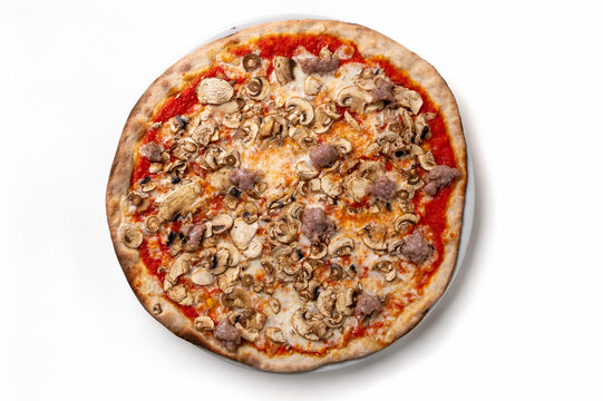 Classic Italian Boscaiola pizza with mushrooms, sausage, mozzarella and tomato sauce isolated on white background.