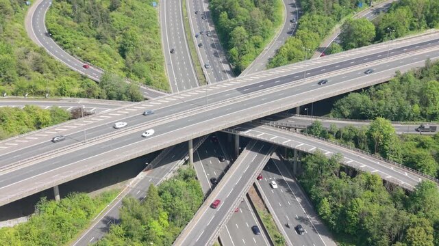 Multilevel Highway Junction Cars and Trucks Driving at Daytime