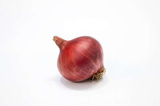 Photographic work with dried onions, an indispensable part of world cuisine and the Mediterranean, on a white background.
