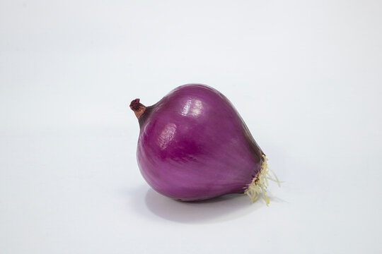 Photographic work with dried onions, an indispensable part of world cuisine and the Mediterranean, on a white background.